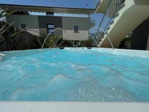 a hot tub in the backyard of a house at Casa Bonotto in Desenzano del Garda