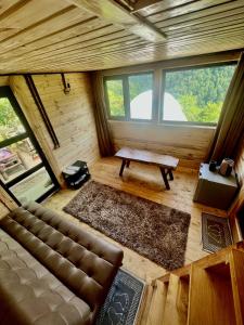 an overhead view of a living room with a couch and a table at Mtirala Skhivi Cottage in Batumi