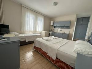 Postel nebo postele na pokoji v ubytování Cicek Apart Hotel