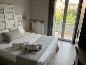 Postel nebo postele na pokoji v ubytování B&B L’ALTRAMURGIA