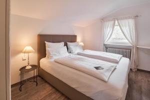 Postel nebo postele na pokoji v ubytování Seehaus Riessersee + 26 fotografií