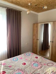 Postel nebo postele na pokoji v ubytování Guesthouse Mtsvane Koncxi 22