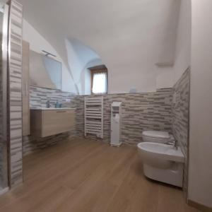 a bathroom with a sink and a toilet at Al Doss in Rabbi