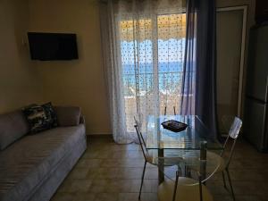 A television and/or entertainment centre at Corfu Glyfada Beach Apartment 40