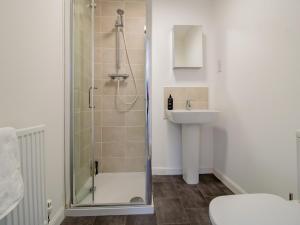 a bathroom with a shower and a sink at Pass the Keys Stunning Newcastle Home in Elswick +35 photos
