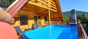 a man standing in front of a house with a swimming pool at Peace of mind in Visoko