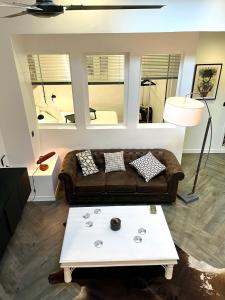 a living room with a couch and a coffee table at Casa Hugo - Guest Suites in Fort-de-France