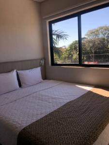 Cama ou camas em um quarto em Iguassu Express Hotel
