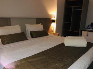 Cama ou camas em um quarto em Iguassu Express Hotel