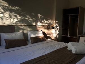 Cama ou camas em um quarto em Iguassu Express Hotel
