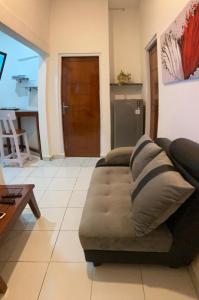 a living room with a couch and a table at LOPE HOMESTAY in Ndangu