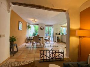 a living room with a table and chairs at Number 30 in Ontinyent