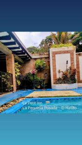a picture of a swimming pool in a house at Posadas Le Petit Inn in Caracas