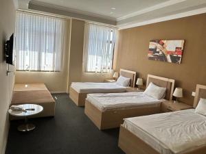 מיטה או מיטות בחדר ב-Agjabedi Olympic Center