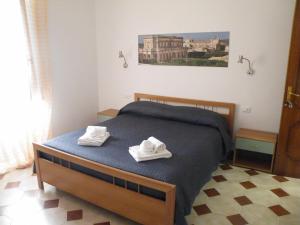 Postel nebo postele na pokoji v ubytování Casa NILLA