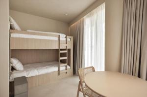 Postel nebo postele na pokoji v ubytování Enso District Hotel