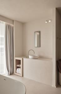 Postel nebo postele na pokoji v ubytování Enso District Hotel