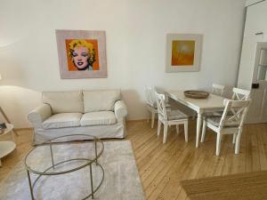 a living room with a couch and a table at Apartment Zum Dom in Graz