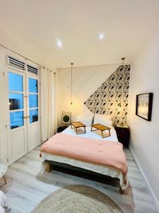 a bedroom with two beds and a wine cellar at Casa Hugo - Guest Suites in Fort-de-France