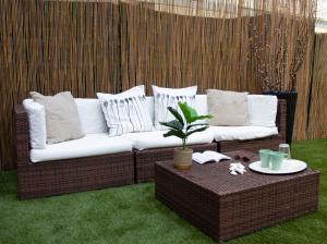 a living room with a couch and a table at Mirage Mer B&B in Catania