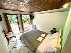 Cama ou camas em um quarto em Casa Selva - Vila do Abraão - Ilha grande