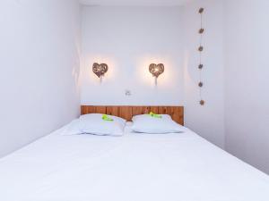 Un pat sau paturi într-o cameră la Appartement Avoriaz, 2 pièces, 4 personnes - FR-1-314-117