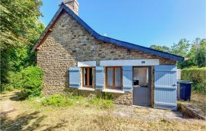 a small stone cottage with blue doors and windows at Holiday Home Nevez Rue De L'aven in Névez +18 photos