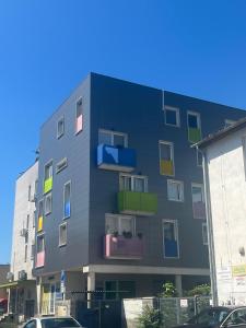 a building with colorful windows on the side of it at Garsónka v Bratislave in Bratislava