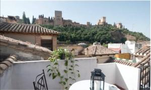 a view of a city from the roof of a house at Apartamentos centro historico a los pies de la Alhambra in Granada