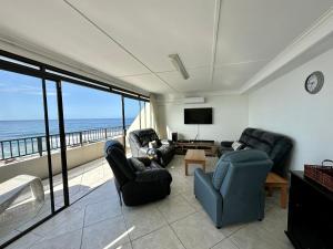 a living room with a view of the ocean at Chamonix 16 in Margate