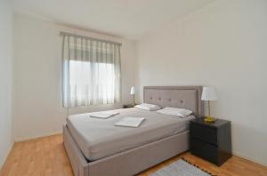 Voodi või voodid majutusasutuse Apartments Stefko 2071 toas