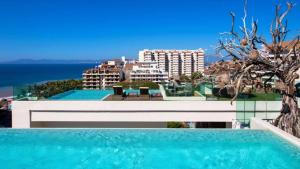 a swimming pool with a view of a city at Nayri Life 509 in Puerto Vallarta