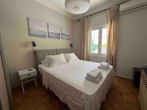 Postel nebo postele na pokoji v ubytování Family Apartment “Atene”