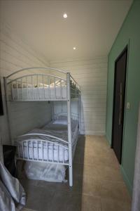 a bedroom with two bunk beds in a room at L'Eden des Grisons in Le Sauze-du-lac