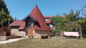 a small house with a red roof at Domaćinstvo Peković in Danilovgrad