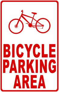 un cartello che legge l'area di parcheggio per biciclette con una bicicletta sopra di Rosso di Sera Loft a Menfi