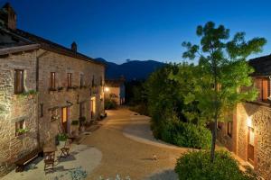 an empty street in a village at night at Casale con vista sui Monti Sibillini e piscina in Amandola
