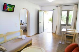a living room with a couch and a table at Elpida Village in Istro