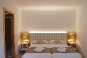 A bed or beds in a room at Sóller Center