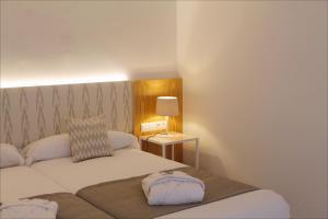 A bed or beds in a room at Sóller Center