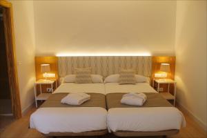 A bed or beds in a room at Sóller Center