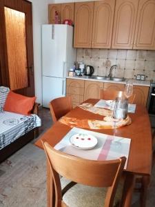 a kitchen with a table with a plate on it at Aunt Vaso Sweet Home in Ptolemaida