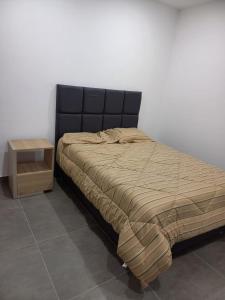A bed or beds in a room at Casa de Campo Las Tujas