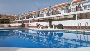 a swimming pool in front of a cruise ship at El Mirador Sea View - Air conditioning - Los Cristianos in Los Cristianos