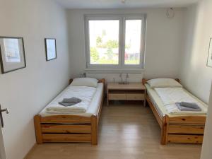 Postel nebo postele na pokoji v ubytování Esslinger Hauptstr Spacious apartment with loggia