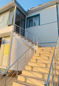 a set of stairs in front of a house at Lori Gardenia Hotel in Stjar