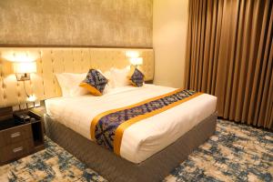 Letto o letti in una camera di Oriens Hotel