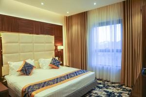 Letto o letti in una camera di Oriens Hotel
