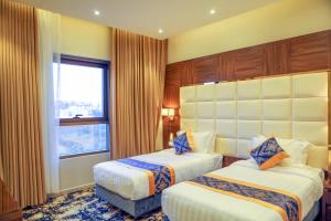 Letto o letti in una camera di Oriens Hotel