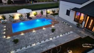 an overhead view of a swimming pool in a backyard at Palomino house in Sinj +59 photos